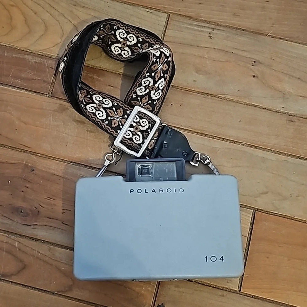 Vintage Polaroid automatic 104 land camera with beautiful strap